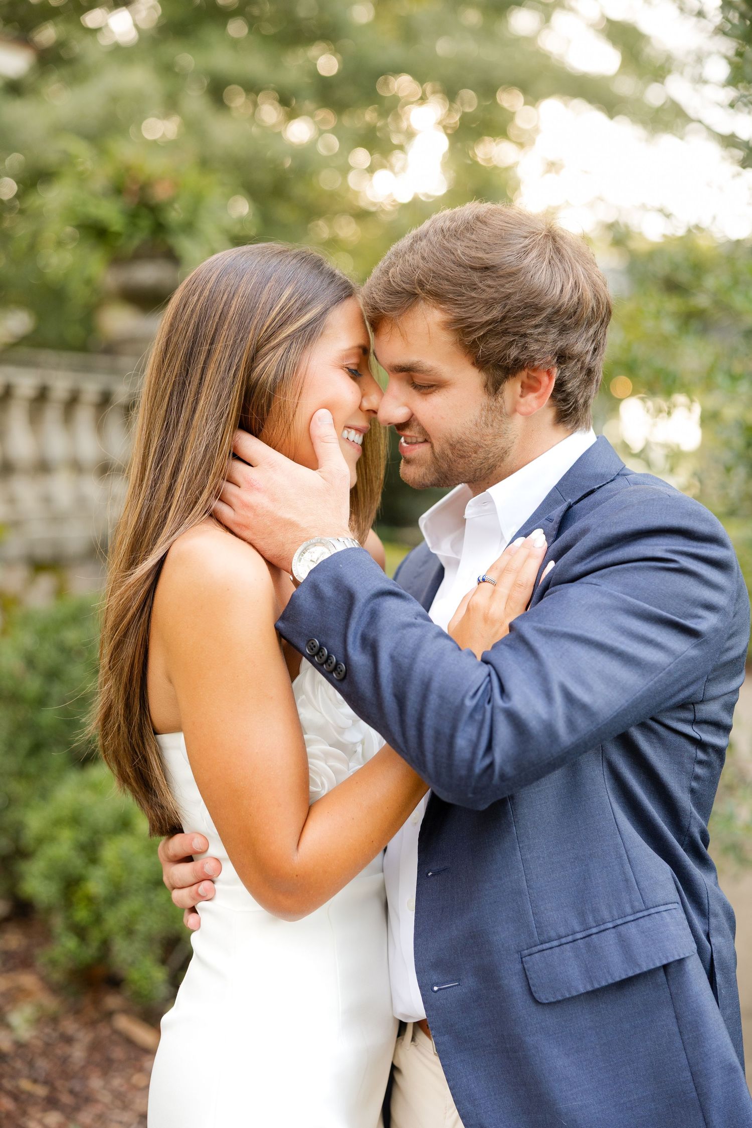 Intimate wedding portraits show tender moments between newlyweds against a natural outdoor backdrop.