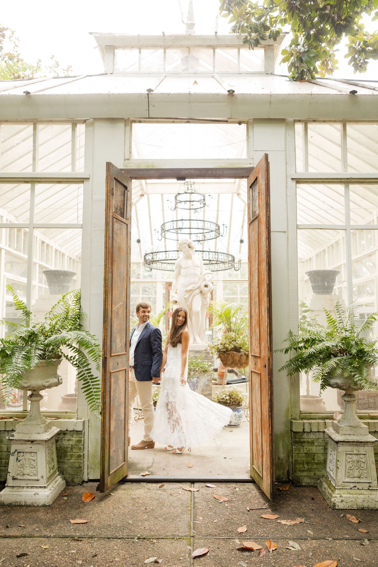 Romantic greenhouse wedding photo sequence with rustic wooden doors and lush greenery in a conservatory setting.