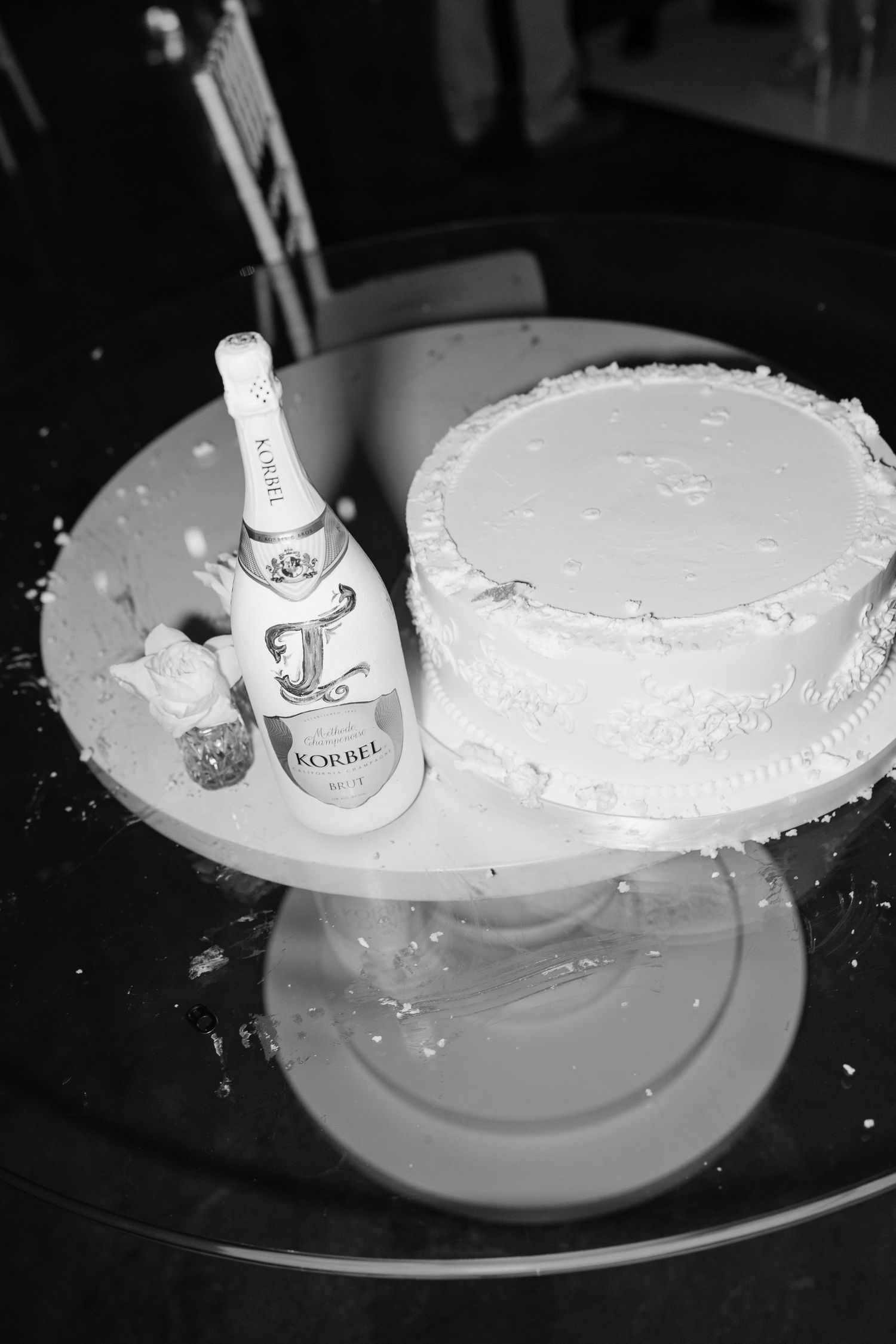 A sequence of black and white photos showing a wine glass falling and spilling on a white plate. Cold Springs Events.