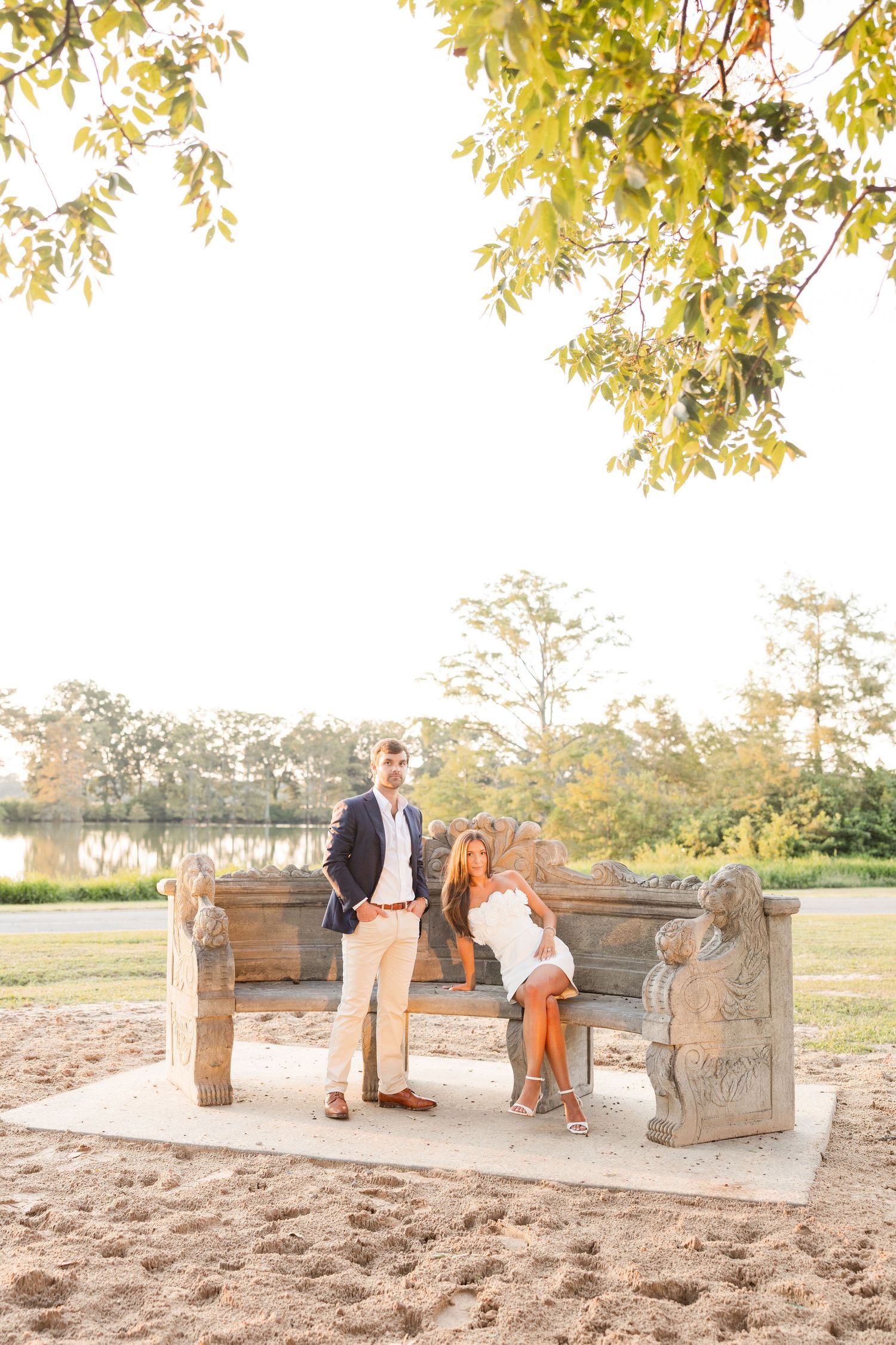Family enjoying a warm autumn day together on rustic wooden benches surrounded by golden leaves and natural light.