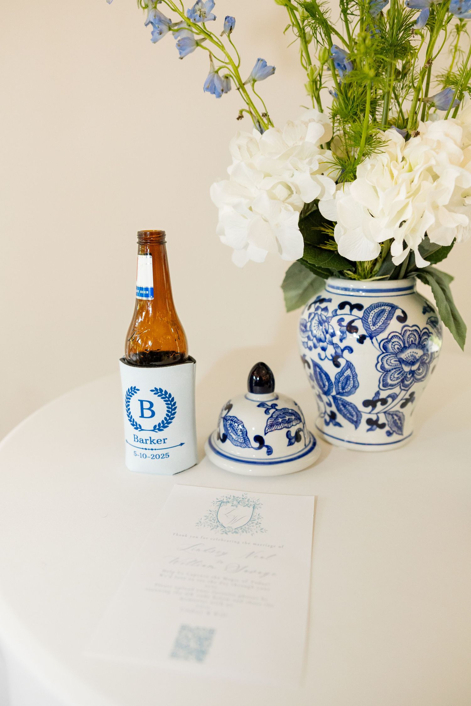White flowers arranged in blue and white porcelain vases with decorative patterns.Cold Springs Events
