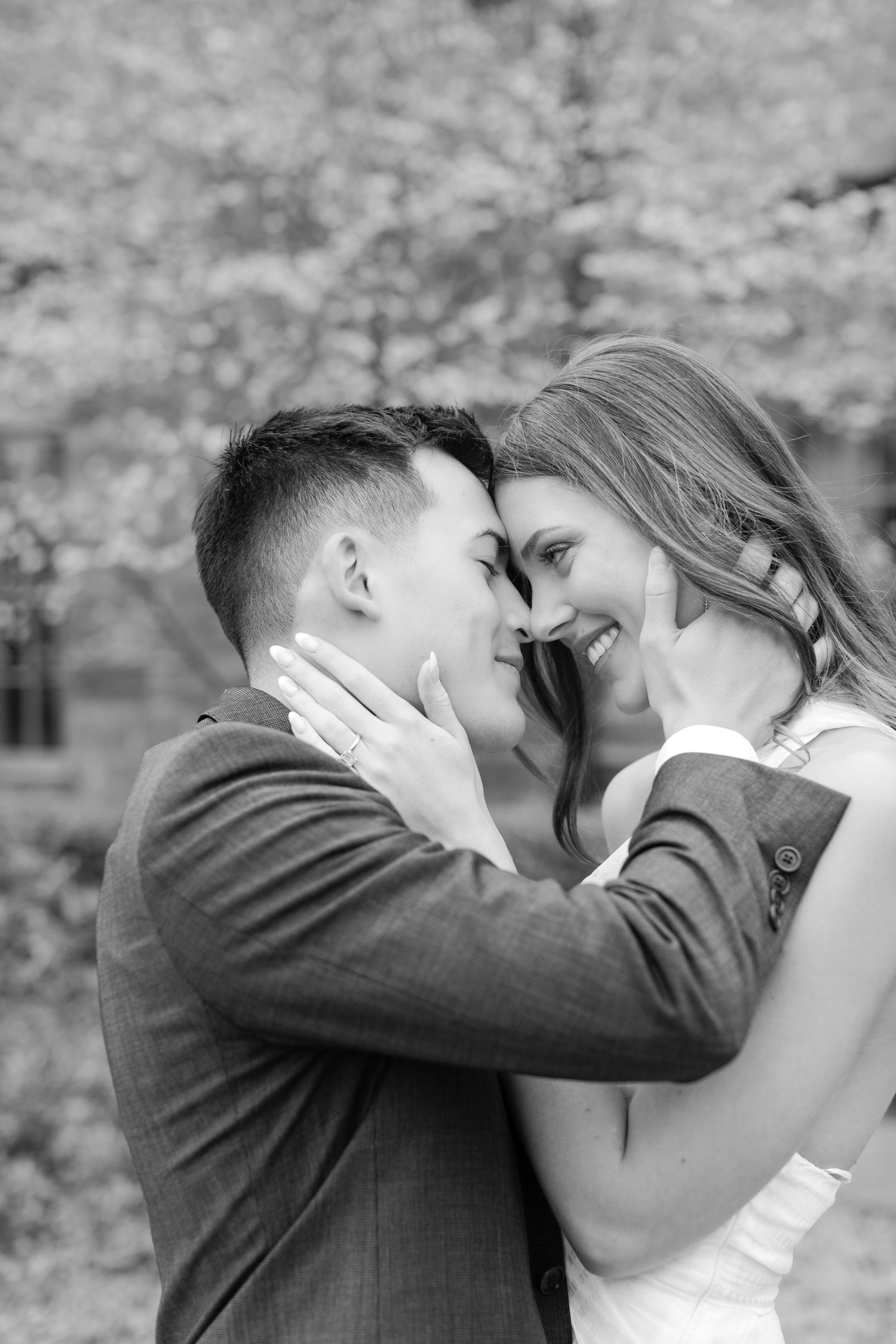 A romantic sequence of black and white photos showing a couple kissing in an outdoor garden setting. Goodwin Manor.