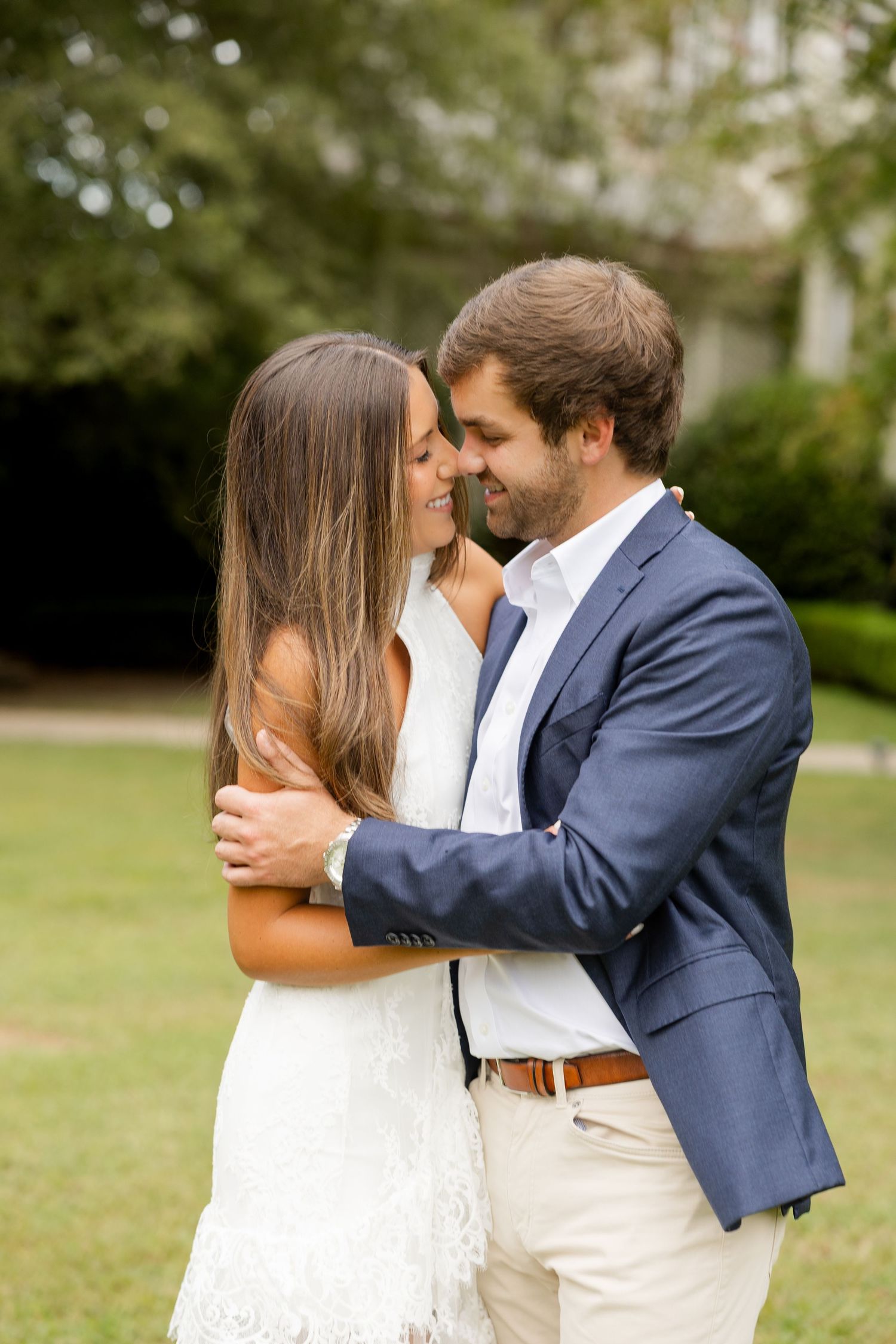 Romantic sequence of couple sharing tender moments on a sunny lawn.