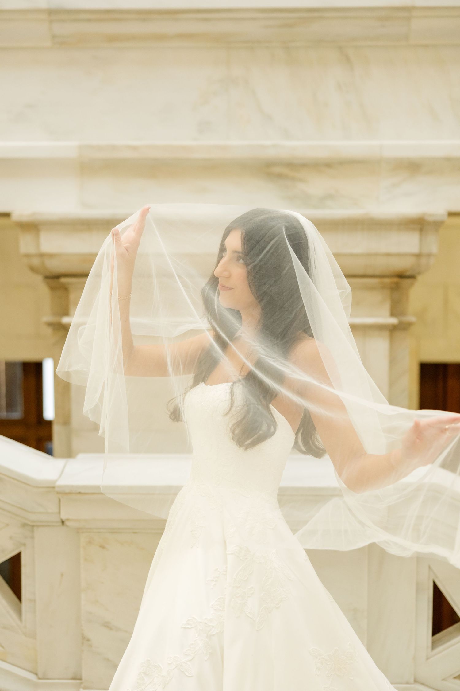 Flowing white bridal veil captured in a soft, dreamy sequence of movement.