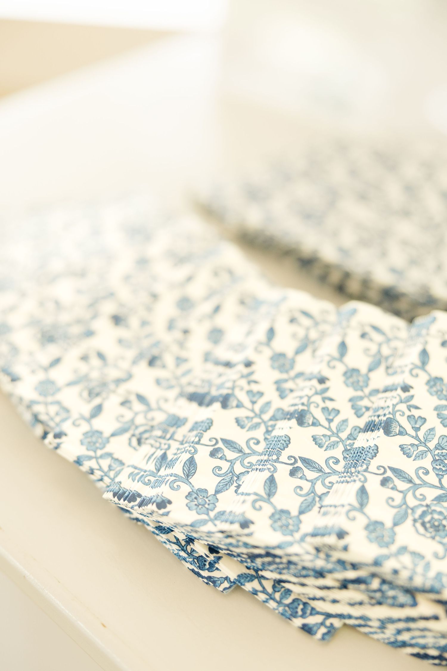 Blue and white floral pattern napkin or tablecloth with delicate design.Cold Springs Events