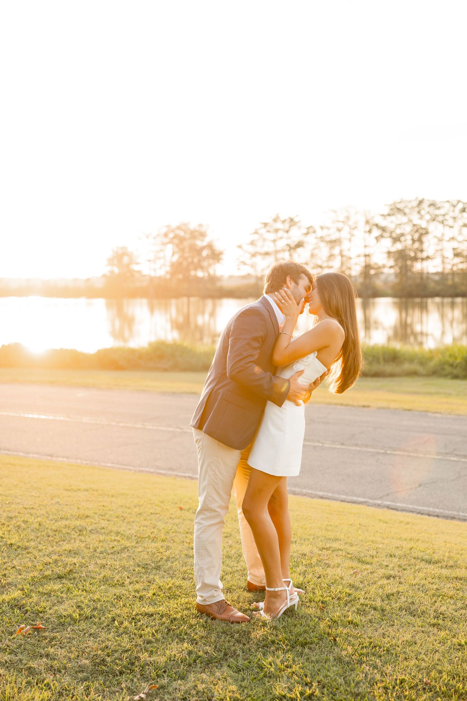 A romantic sunset photoshoot sequence in a grassy field with golden hour lighting.