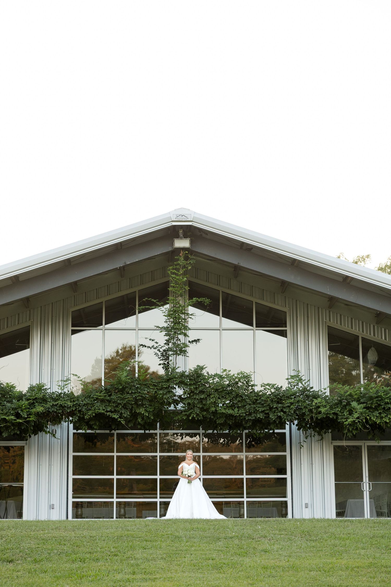 Modern white church building with large windows and angular architecture photographed from different angles.
