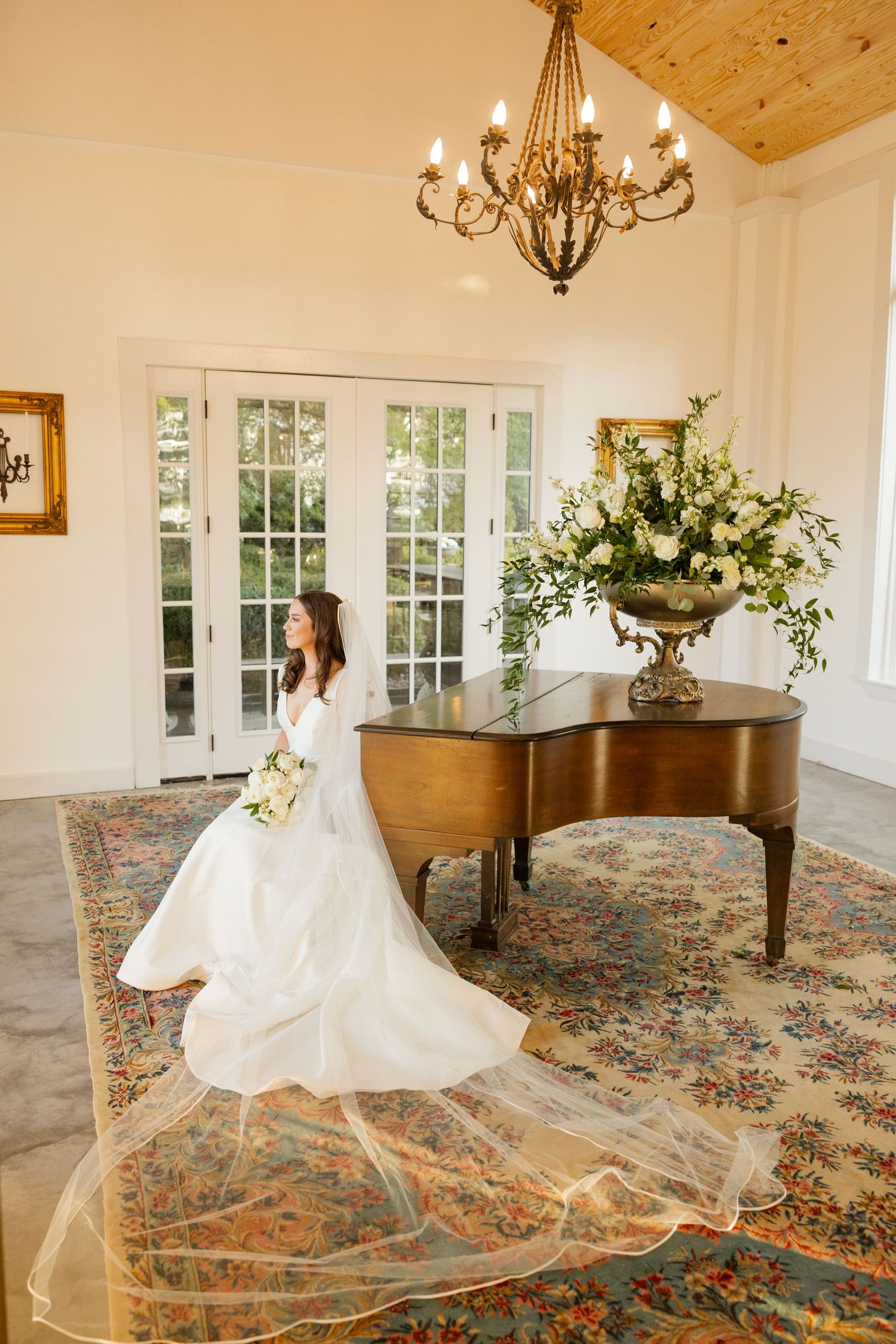 Wedding dress flowing in motion across patterned carpet in elegant indoor venue.Marlgsate Plantation