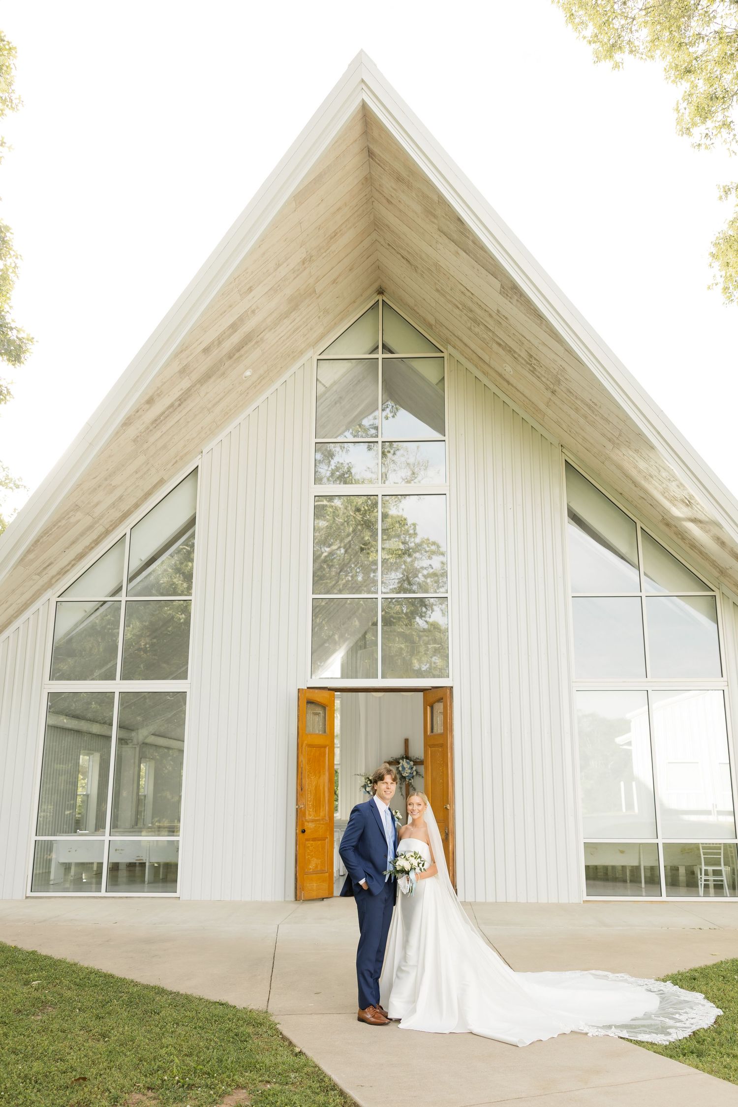 Modern white chapel exterior with dramatic A-frame architecture and large windows.Cold Springs Events