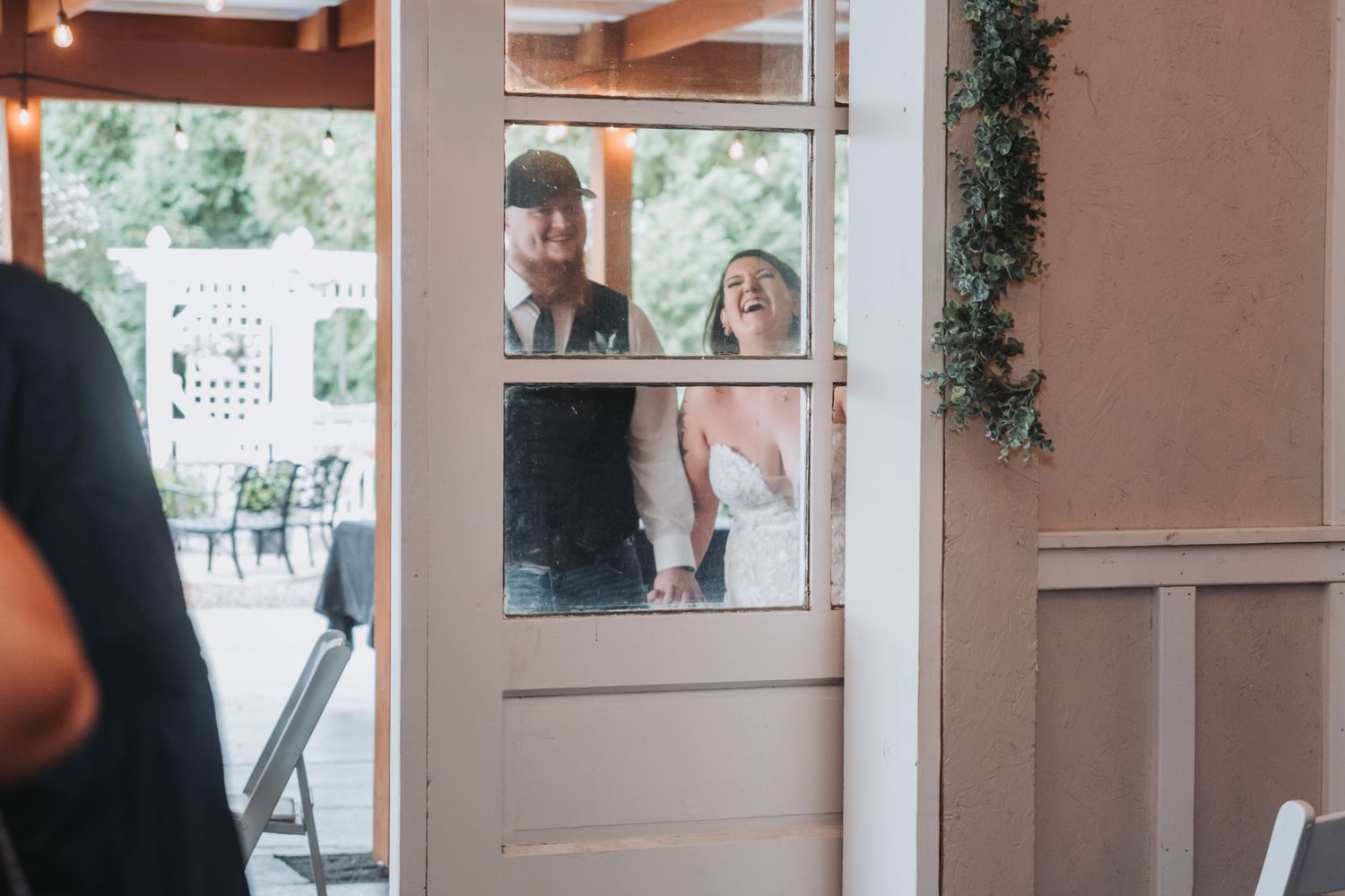 Interior shots of a wedding venue with decorative lighting and rustic wooden beams.