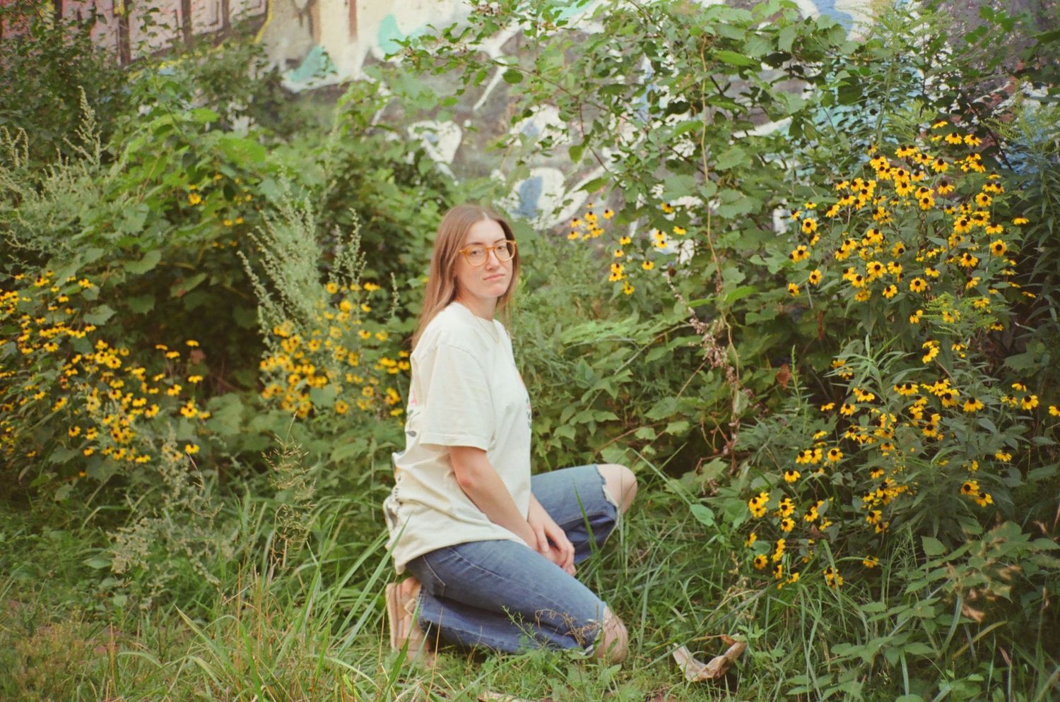 A series of garden photos showing someone sitting among lush greenery and blooming flowers in a peaceful outdoor setting.