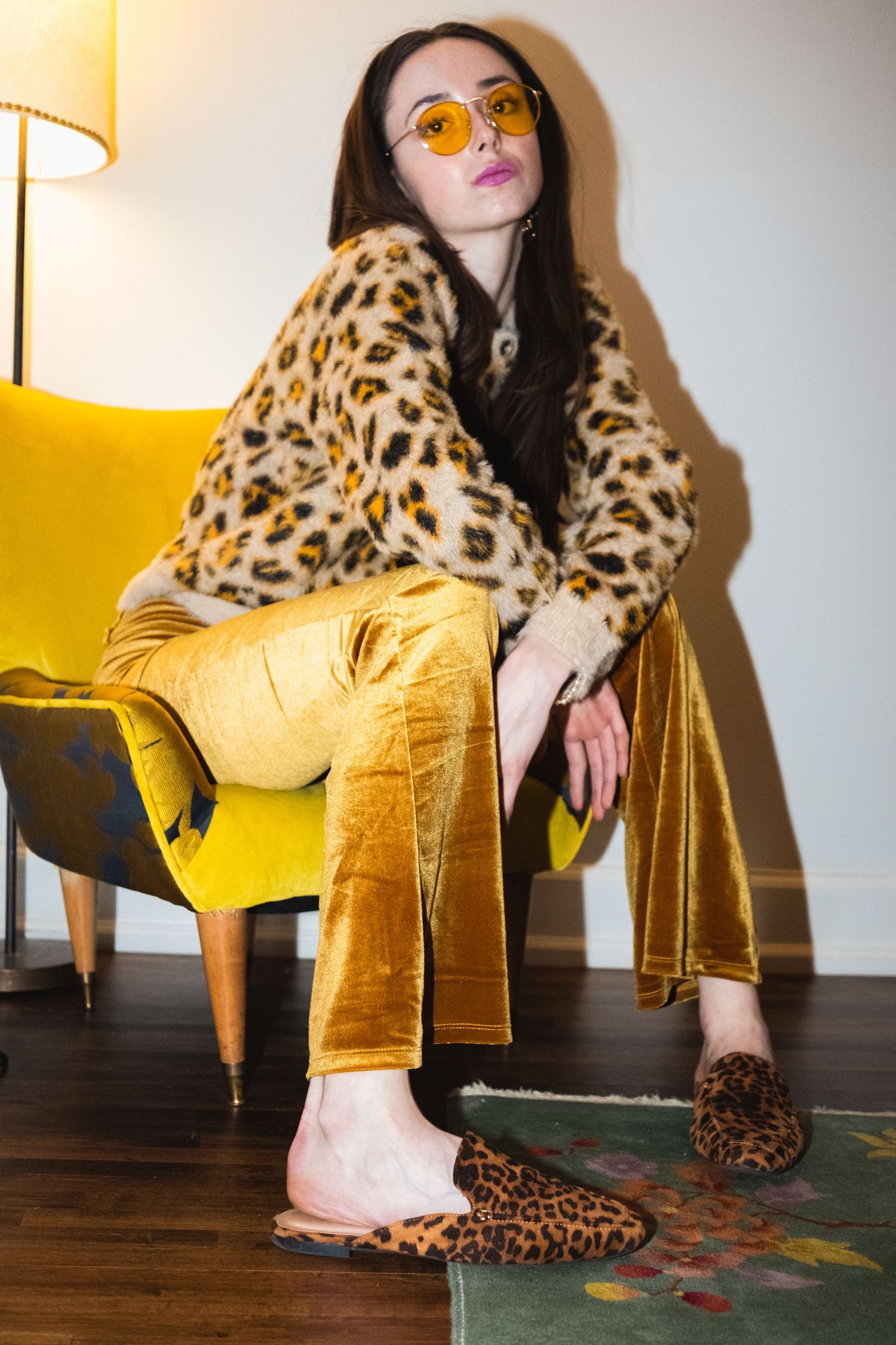 Fashion detail shots featuring leopard print coat and gold velvet pants against wooden flooring.