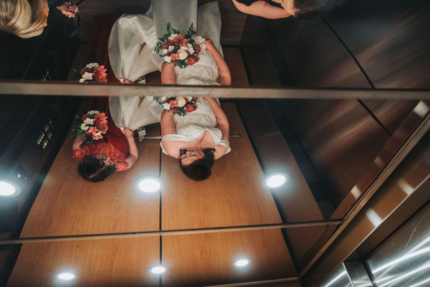 Overhead view of an elevator ride during a wedding celebration.