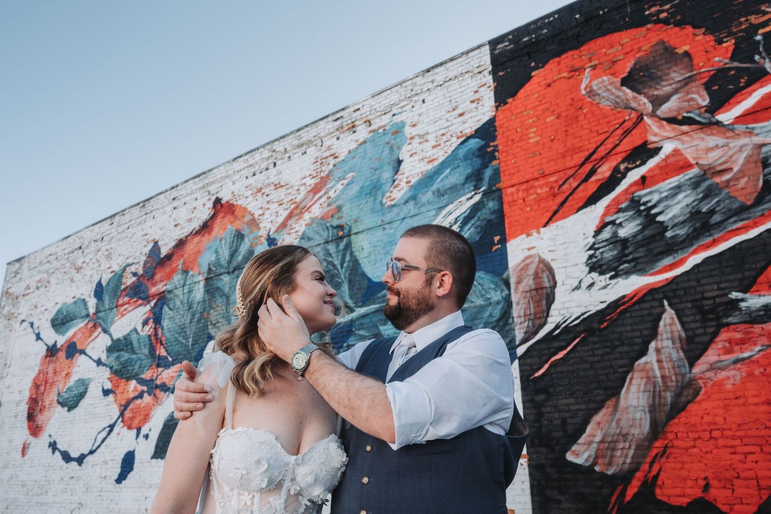 Abstract street art mural featuring bold red and blue geometric patterns.