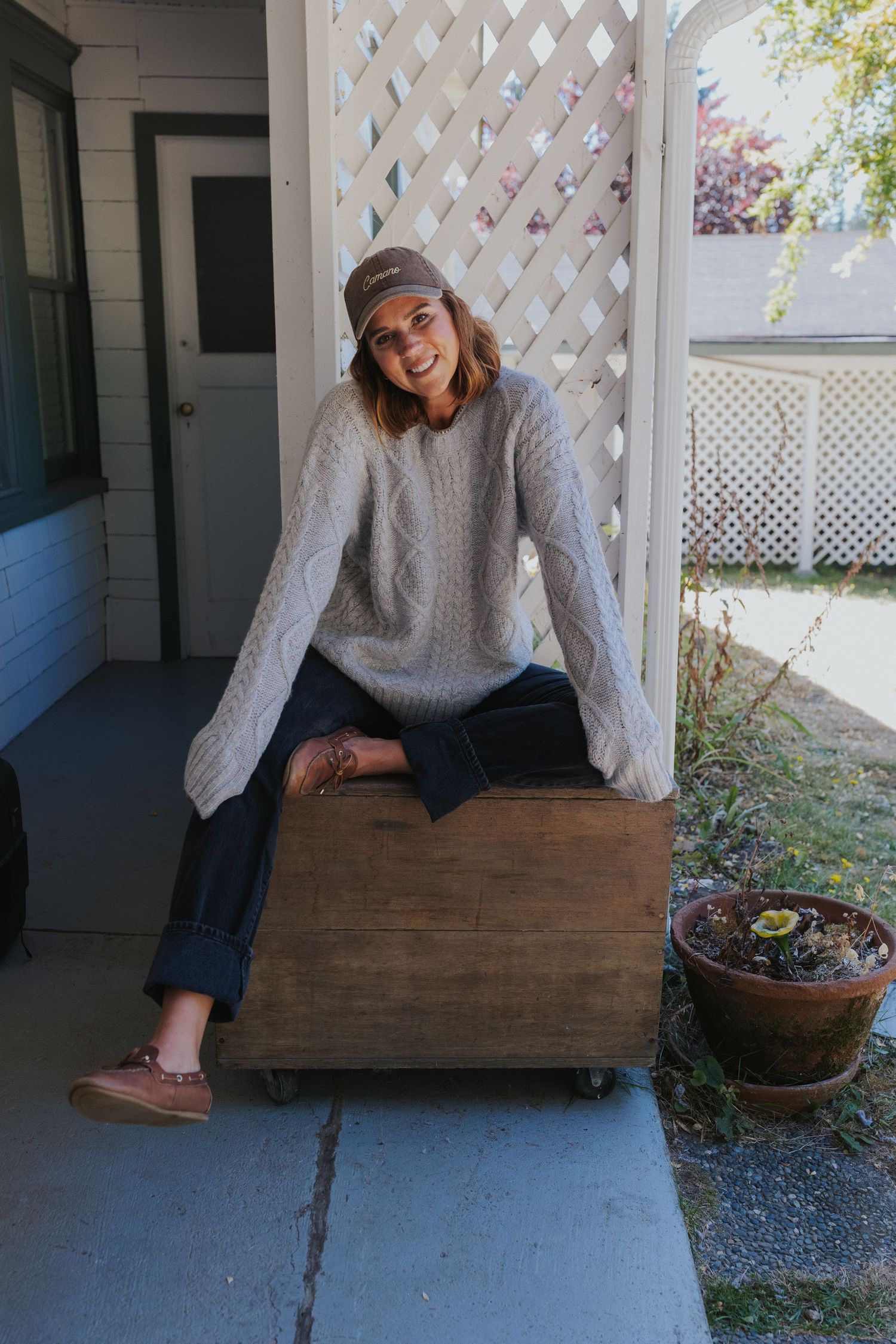 Casual outdoor photo series on a wooden bench against white lattice backdrop.