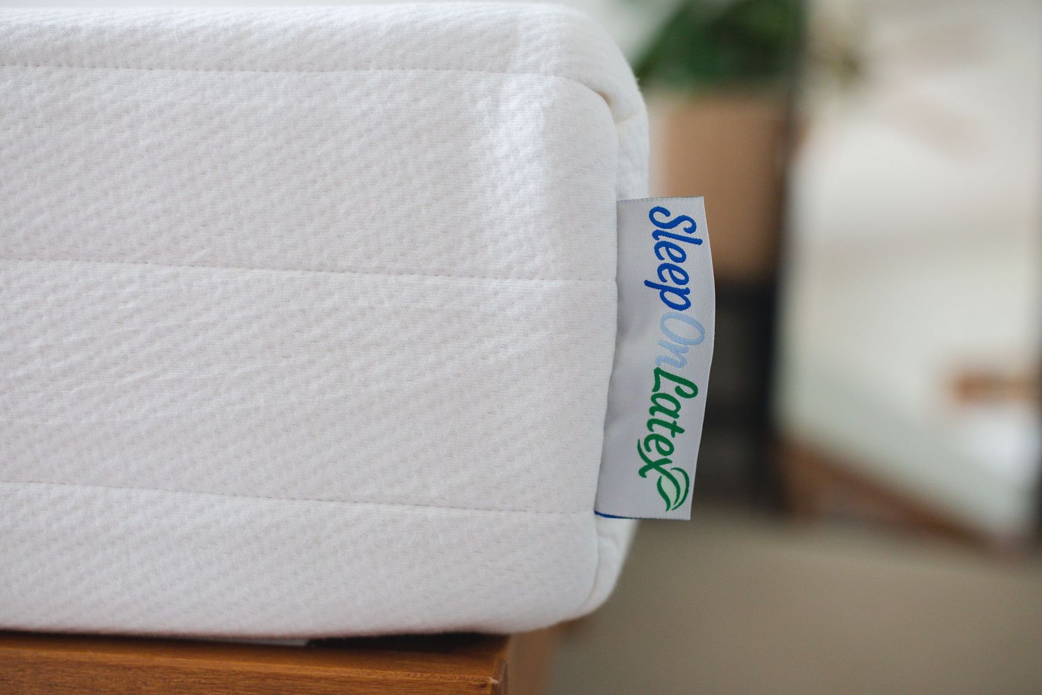 Close-up view of white mattress labels showing product details and specifications.