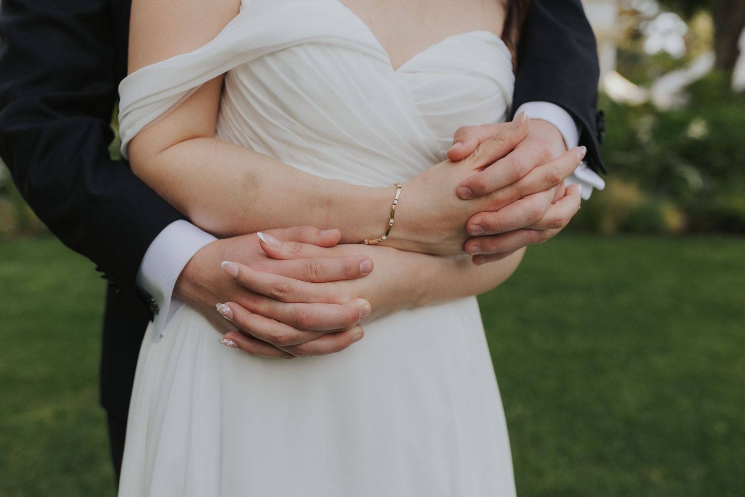 Close-up detail of wedding dress fabric and elegant draping.