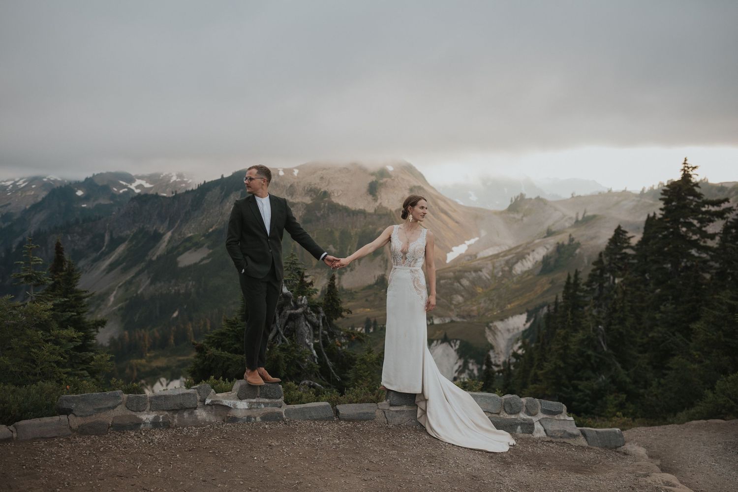 Romantic mountain elopement scene with dramatic landscape views.