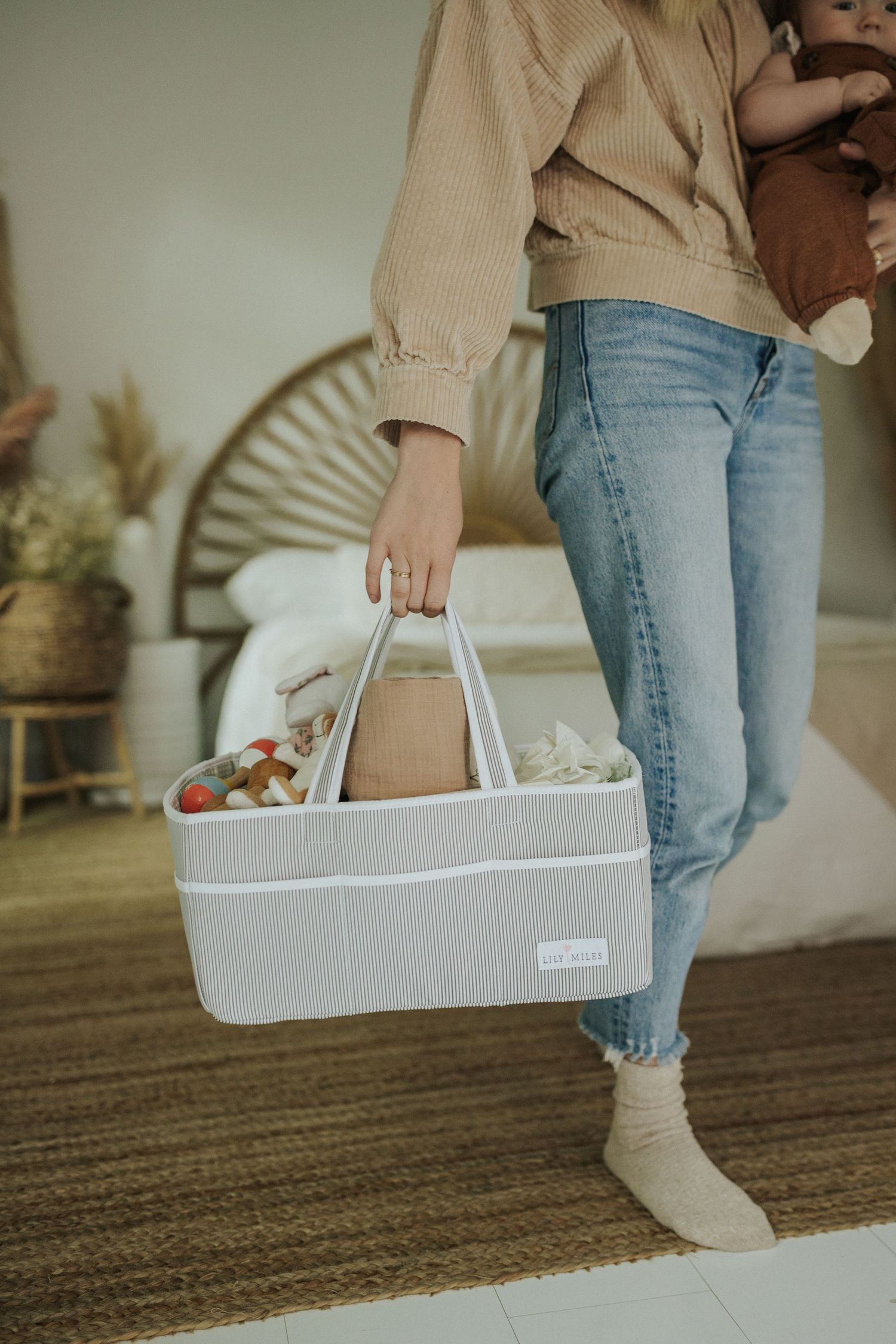 White storage caddy with handles shown from different angles on carpeted floor.