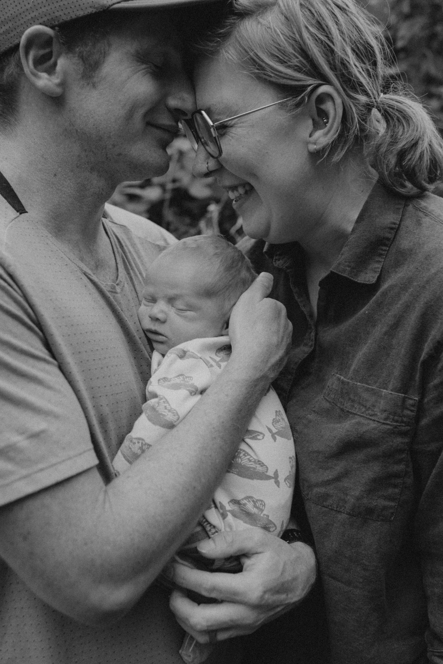 Intimate black and white portrait of couple sharing affectionate moment.