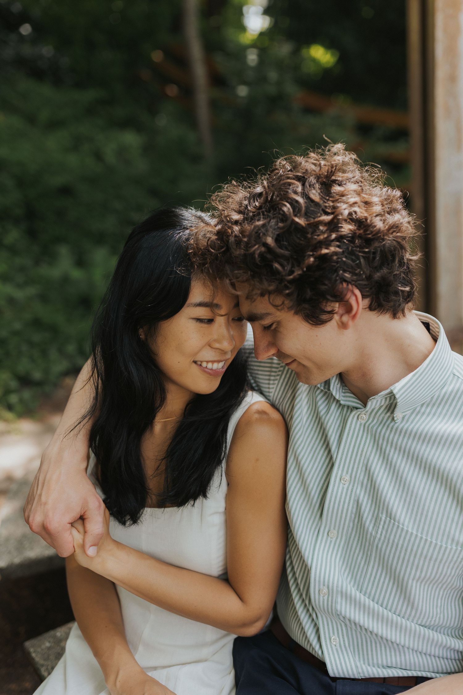 Candid moments of a couple laughing and embracing on a sunny afternoon.