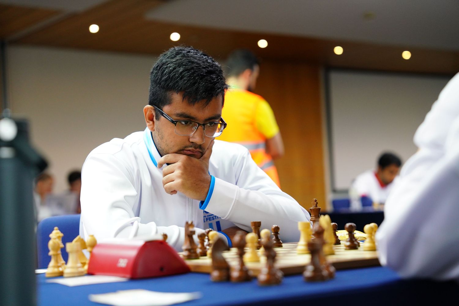 Players focused intently during a competitive chess tournament.