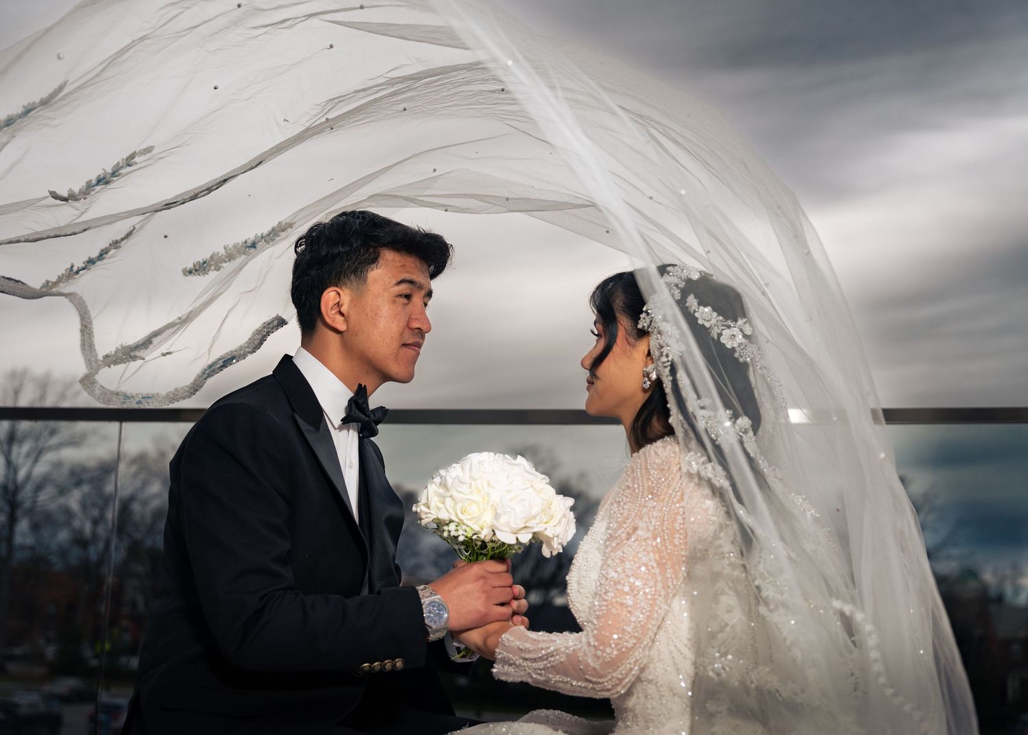 A romantic wedding photo sequence showing intimate moments between a bride and groom under cloudy skies.