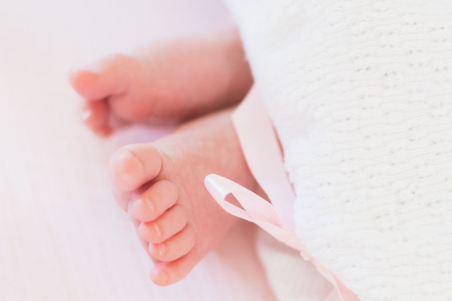 Close up picture of newborn baby's tiny toes