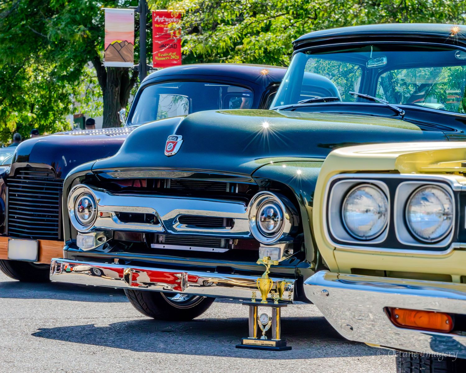A metallic green 1953 Ford truck with a 