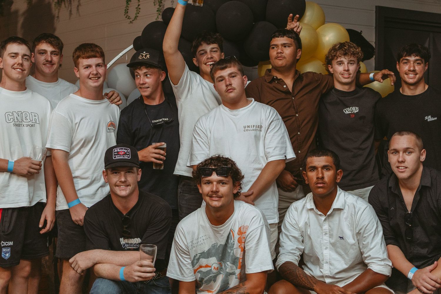 Large group photo of party attendees in casual attire.