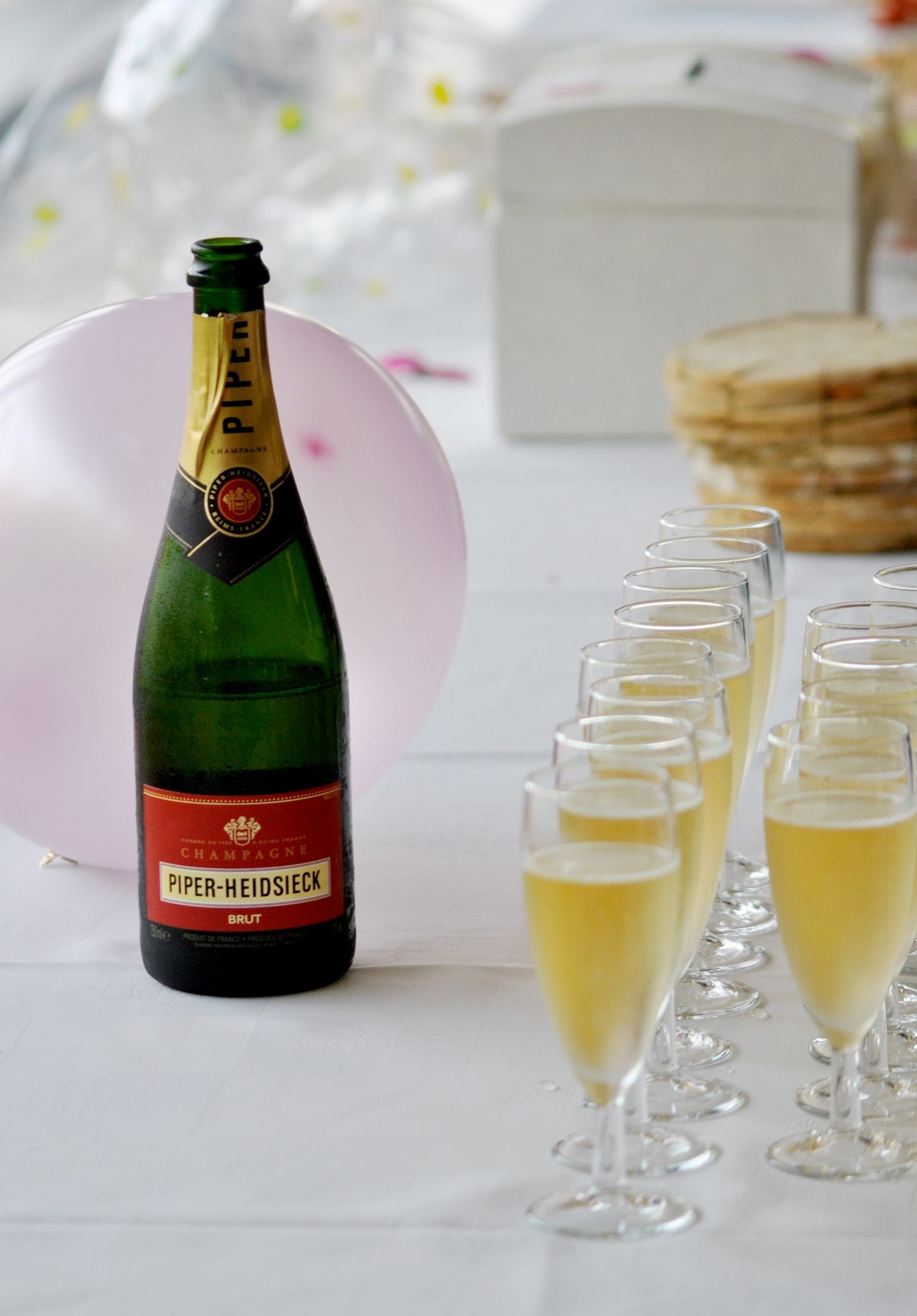 Piper-Heidsieck brut champagne bottle with filled flutes ready for wedding toast.