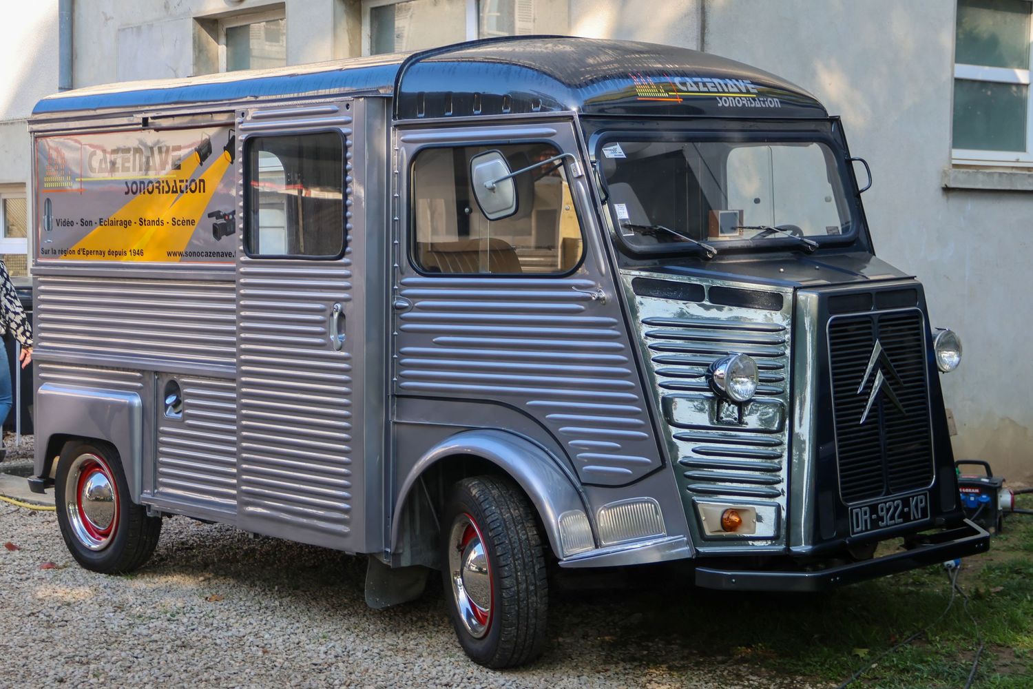 Vintage grey Citroen HY van food truck parked on a street with classic corrugated steel bodywork.