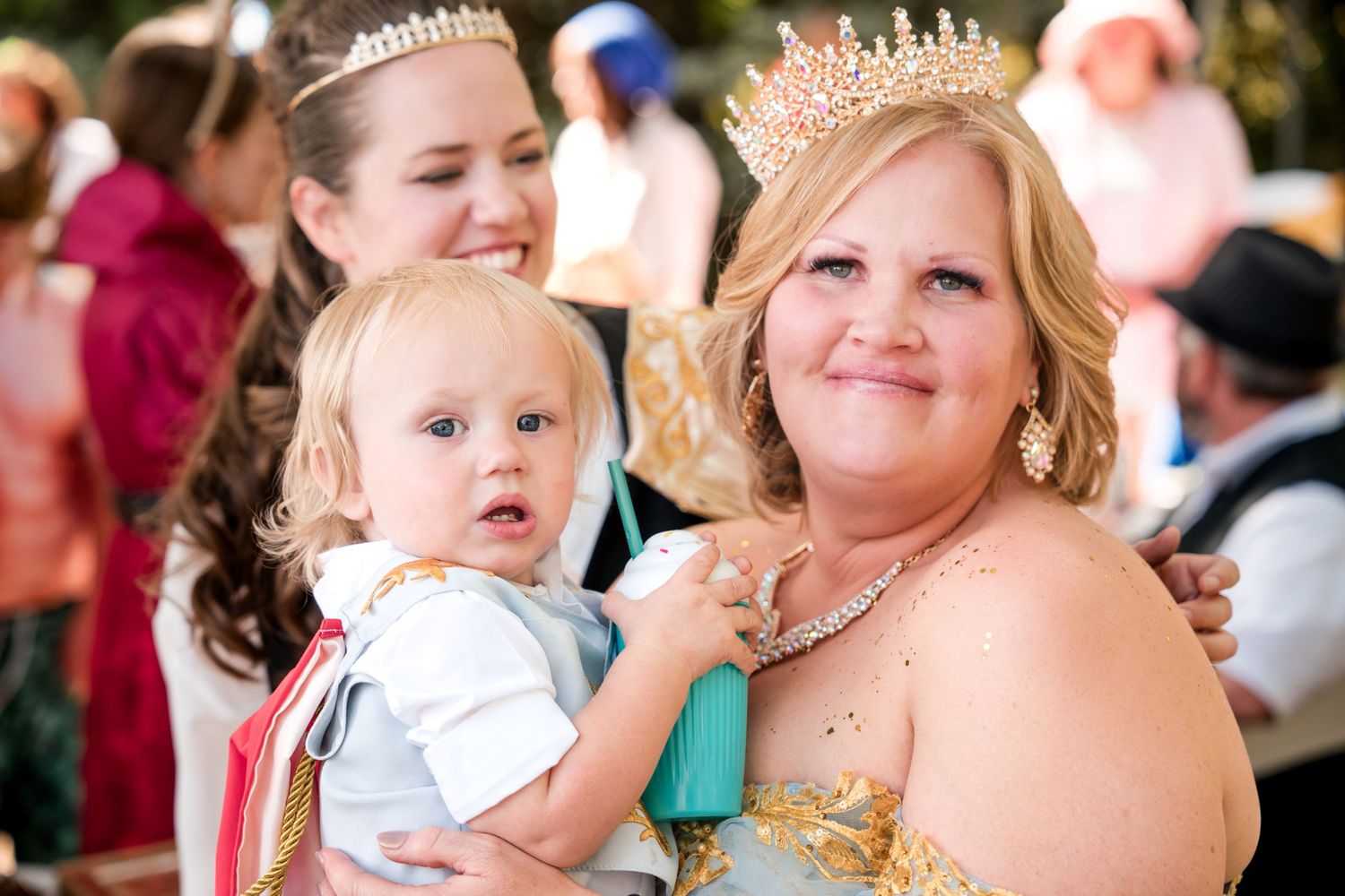 Wedding celebration moment showing crown accessories and joyful interactions at a wedding.