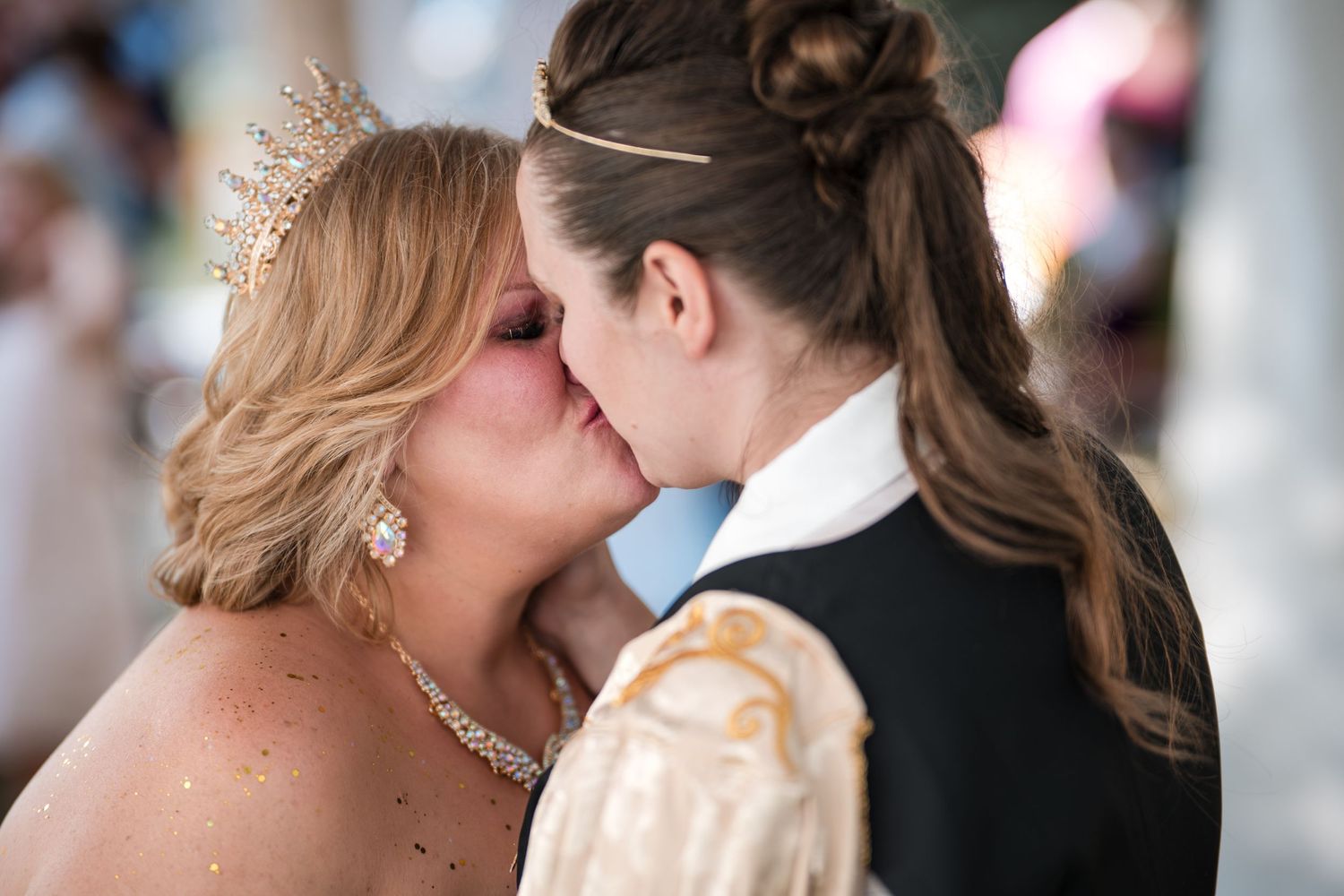 Close-up mosaic of romantic wedding moments showing intimate embraces between couples in formal attire.