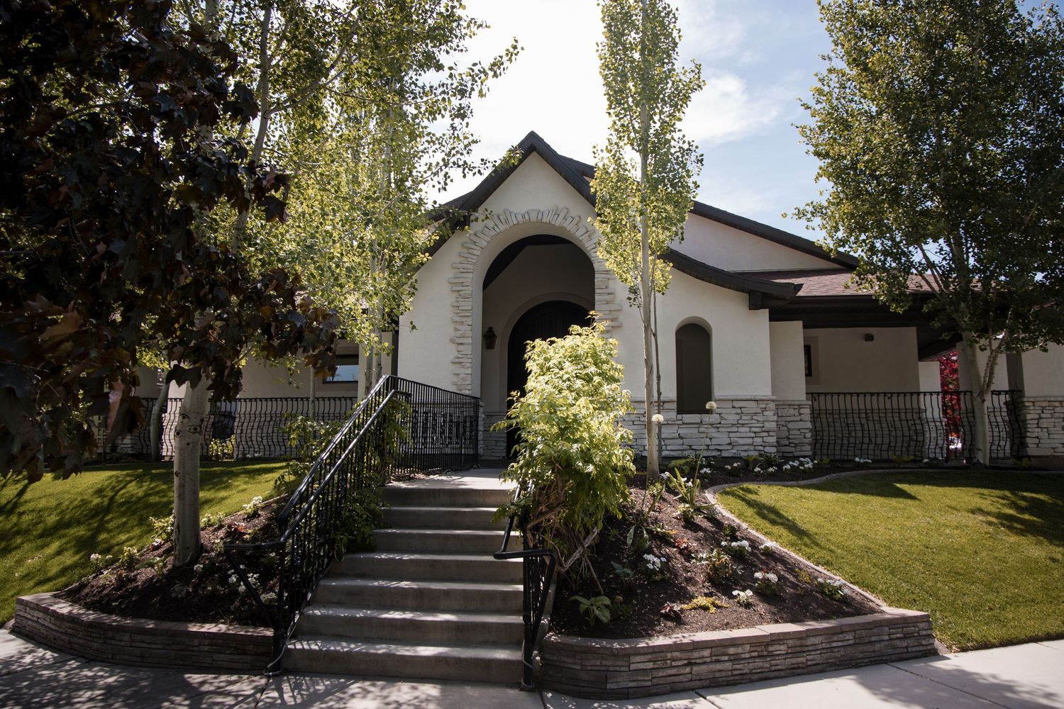 Multiple exterior views of a residential property showing steps, landscaping, and building features in daylight.