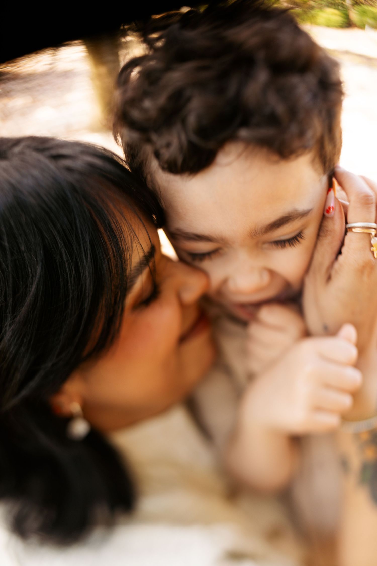 Romantic couple sharing tender kisses in soft lighting across multiple intimate captured moments.