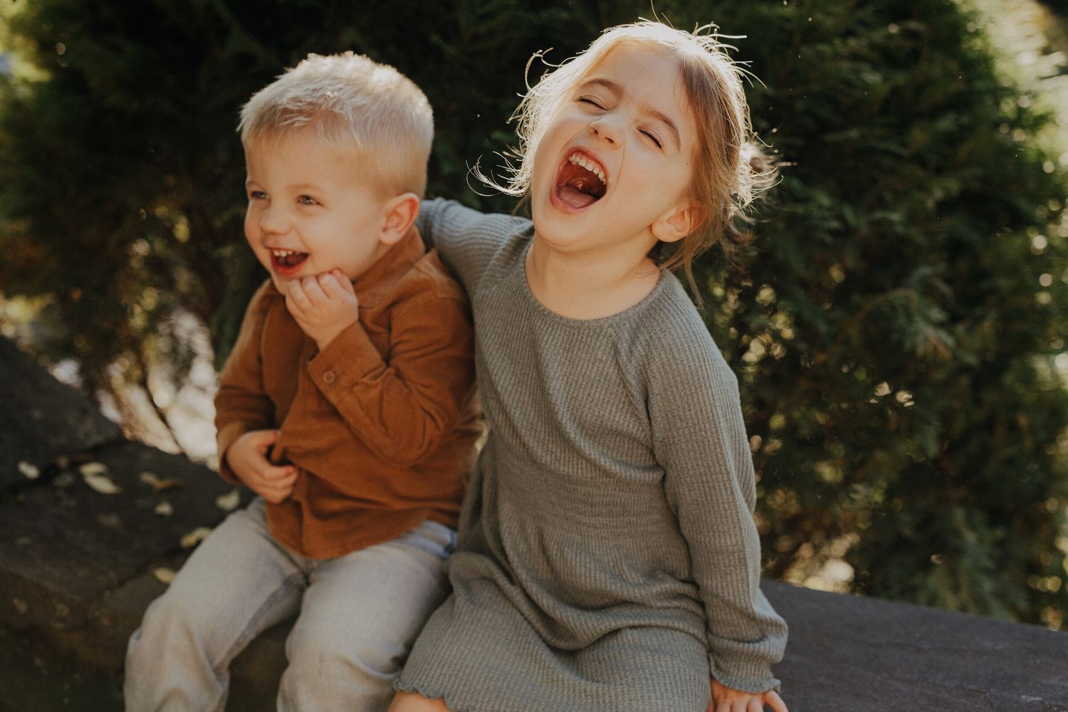 Joyful family candids taken outdoors against a natural backdrop.