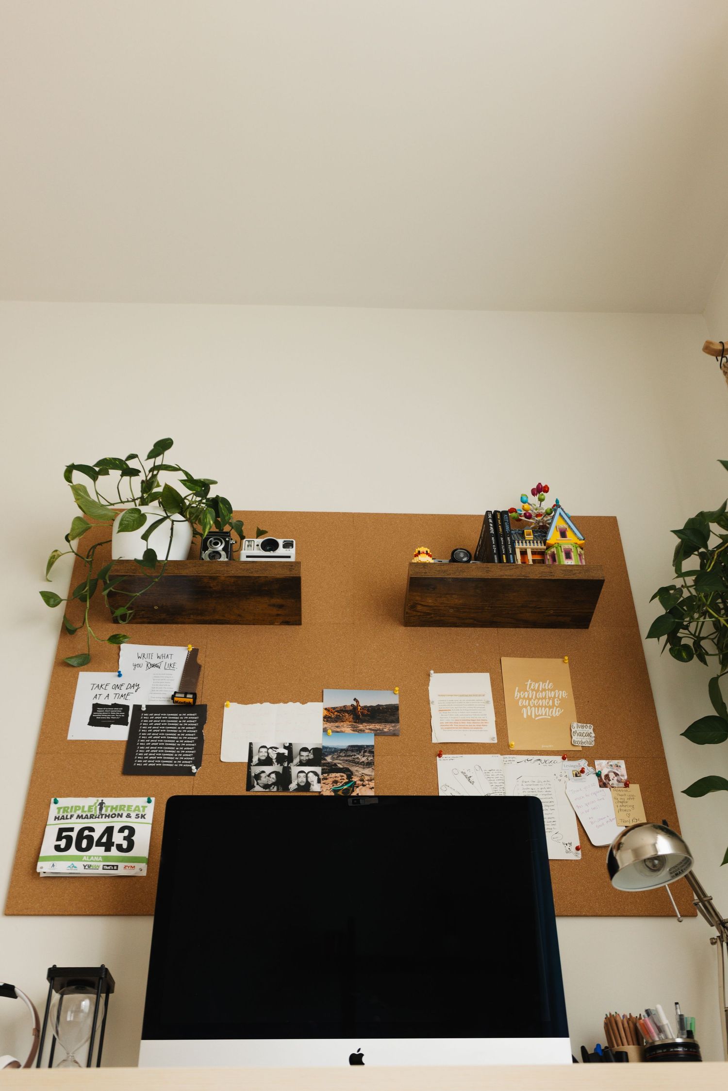 A montage of desk workspaces showing a wooden shelf with plants, decor, and an Apple computer setup against a white wall.