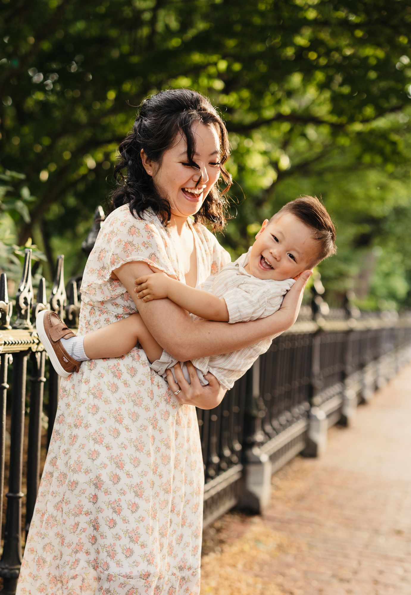 Playful interactions on a tree-lined path during golden hour.