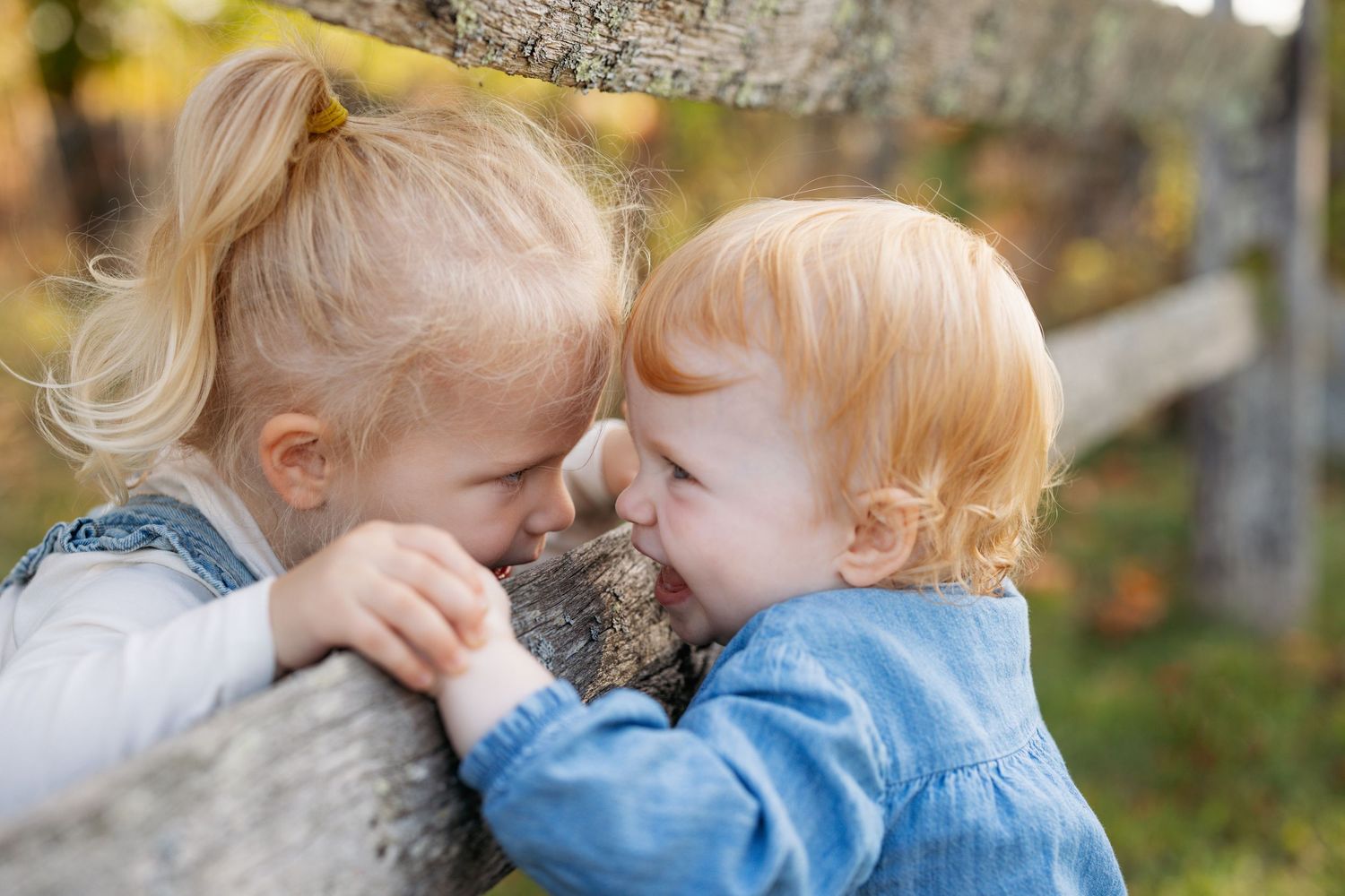 Tender moments shared between loved ones during a fall photo session outdoors.