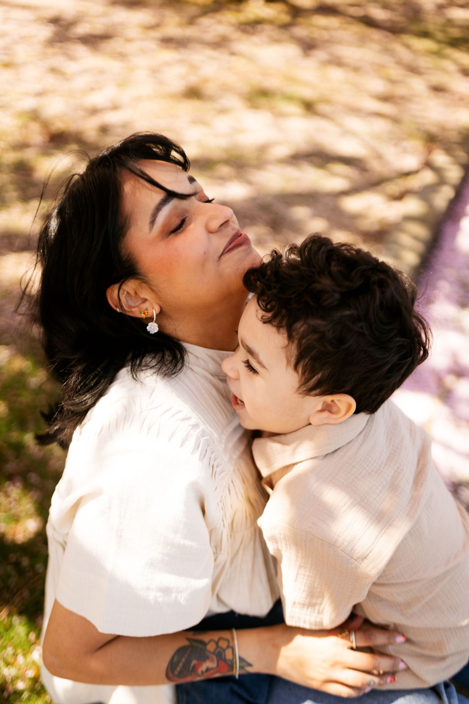 A romantic couple in white clothing embrace affectionately outdoors in a multi-photo sequence.