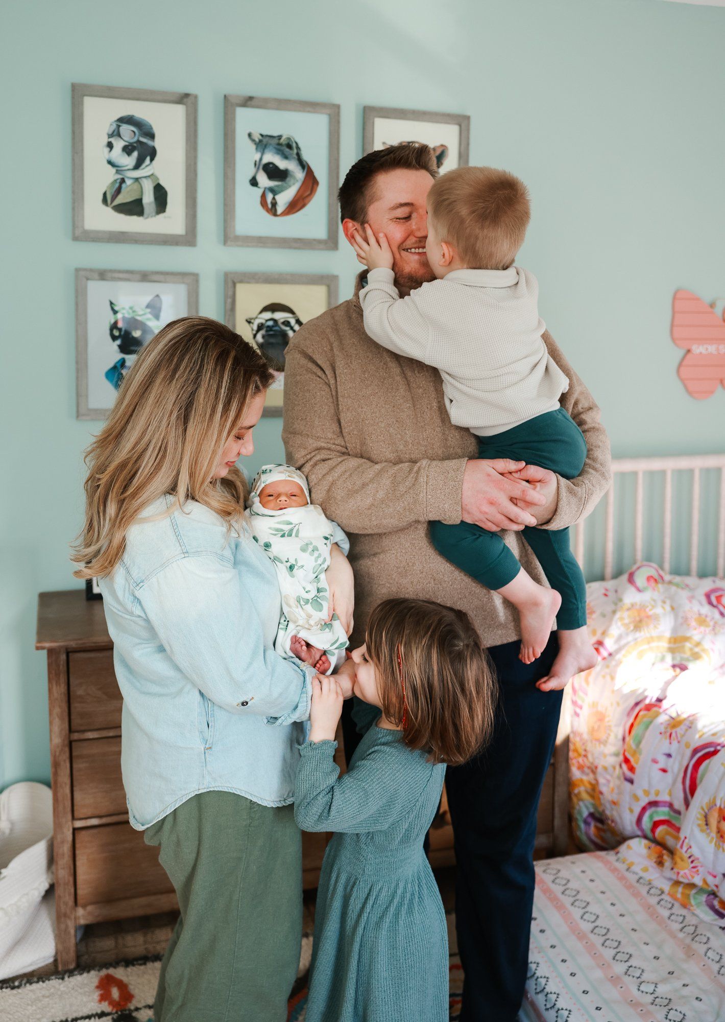 Collage of four images showing parents spending sweet quality time with young children in a soft-lit bedroom.
