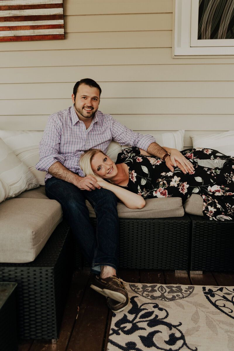 Relaxed lifestyle photography session on a cozy outdoor patio furniture.