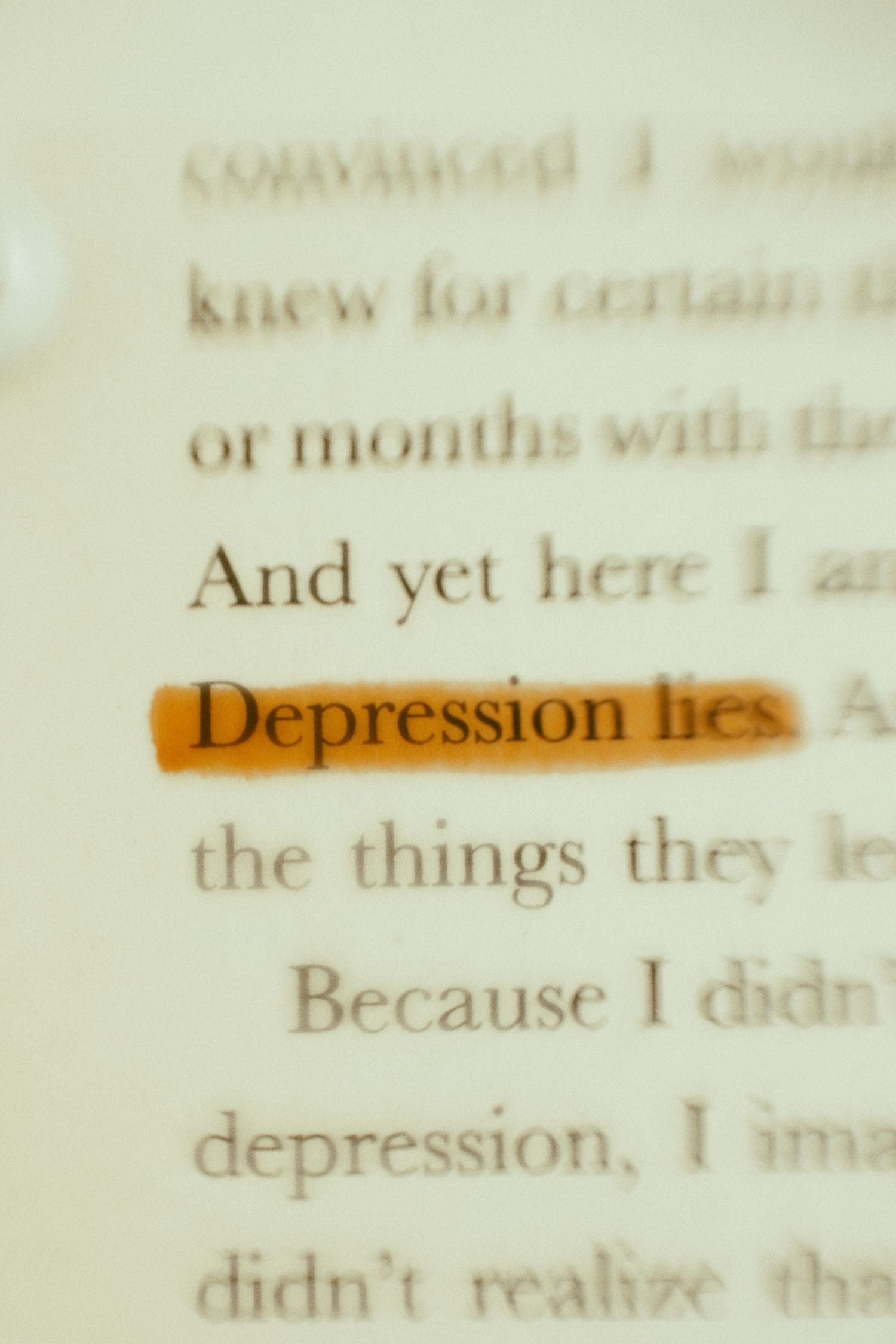 Close-up shot of the word 'Depression' highlighted in orange on a page of text.