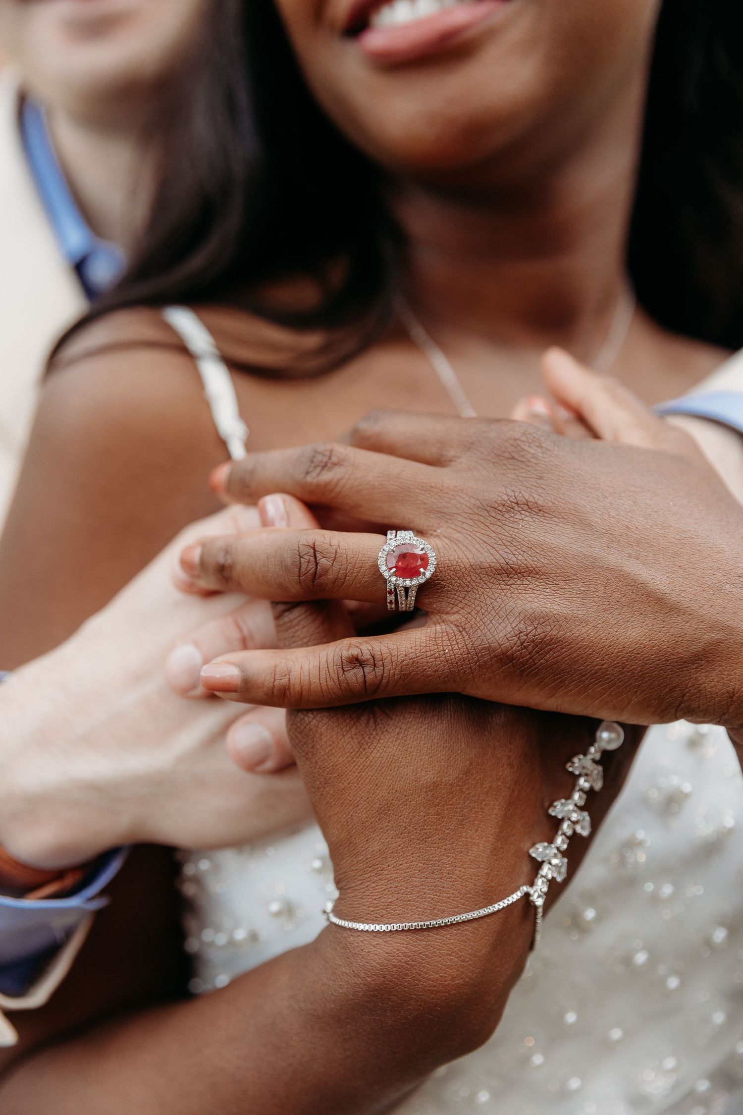 A series of close-up shots showing hands exchanging rings and jewelry during a wedding ceremony.