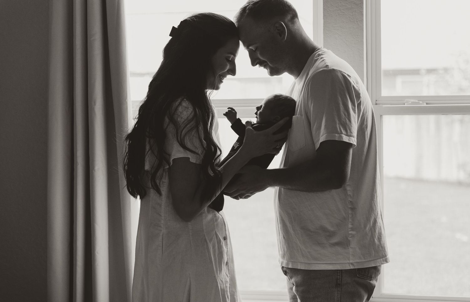 A series of romantic black and white silhouettes showing tender moments between two people in intimate poses.