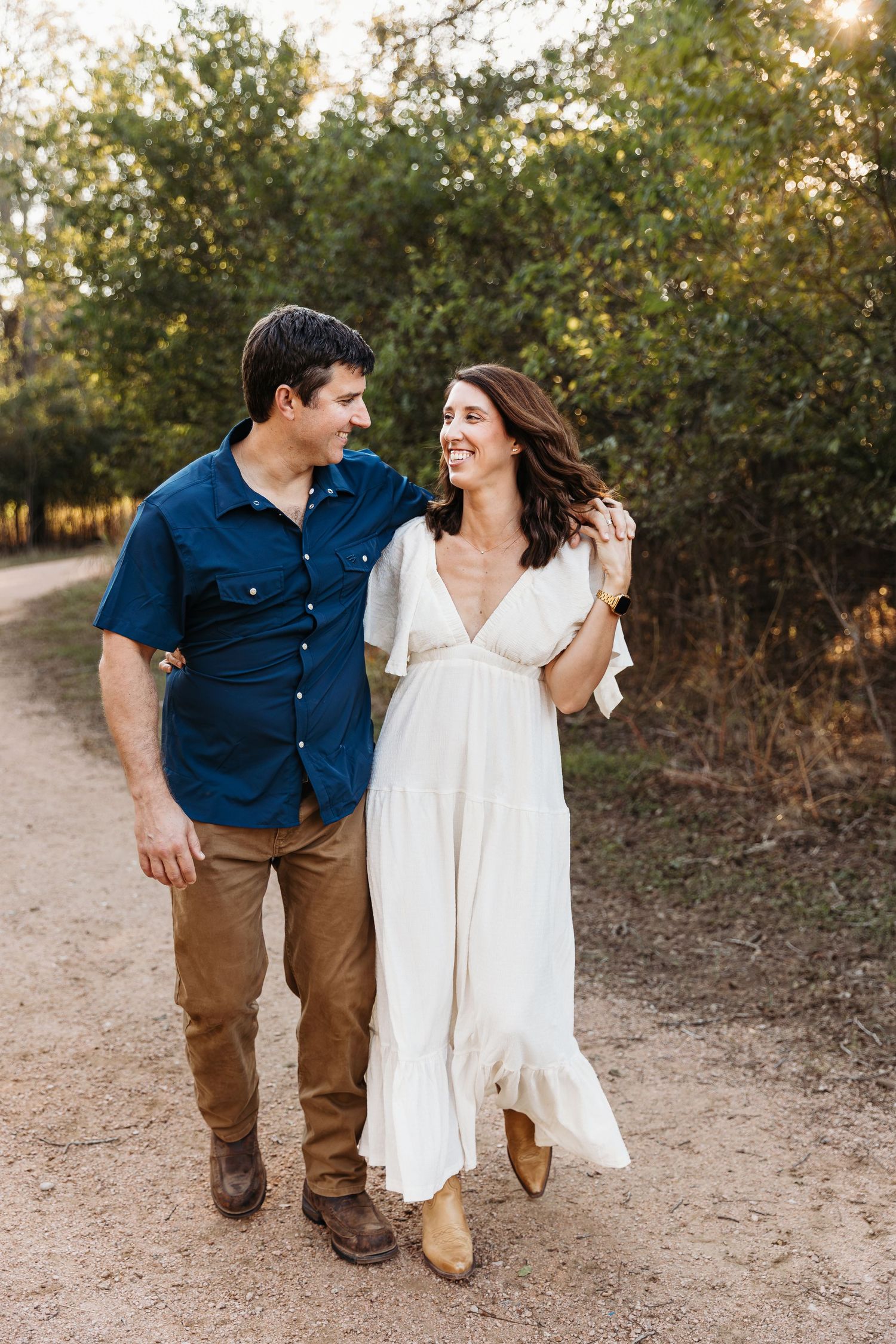 San Antonio couple with arms around each other at crescent bend nature park.