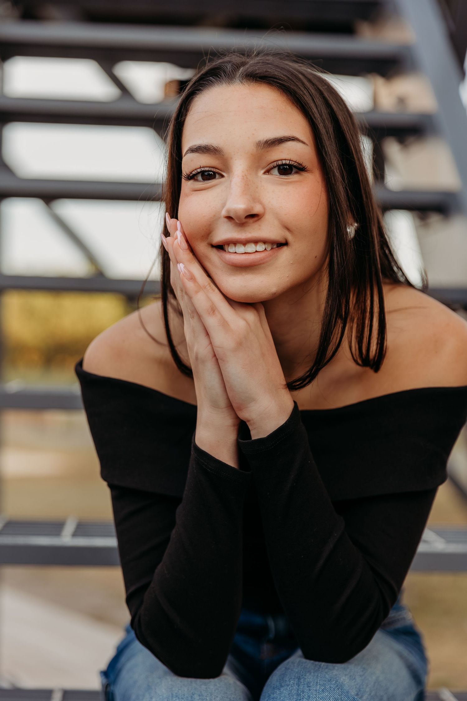 A series of candid portrait photos showing someone in a black sweater expressing joy and playfulness through different poses.