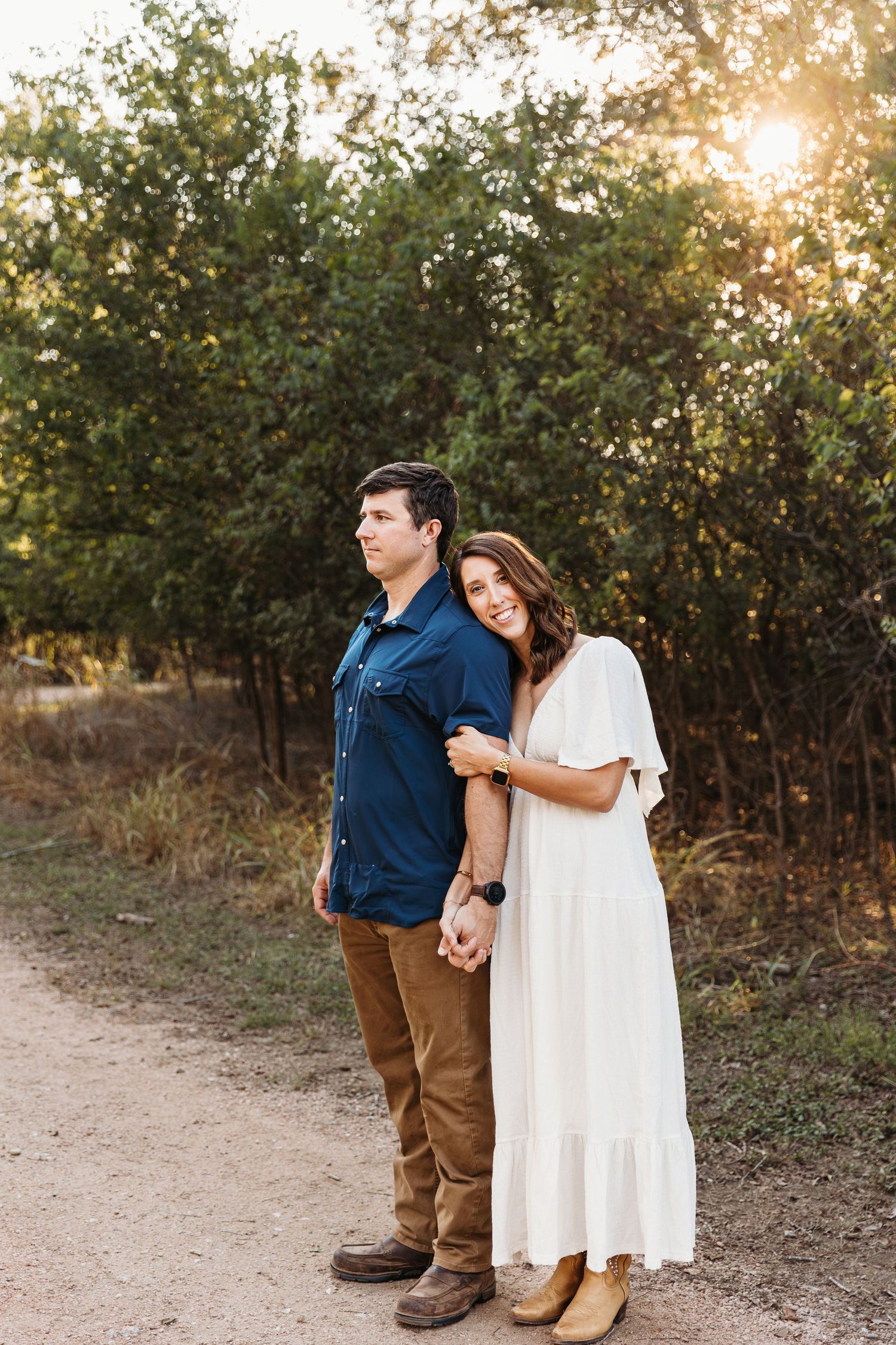 San Antonio couple snuggling at crescent bend nature park.