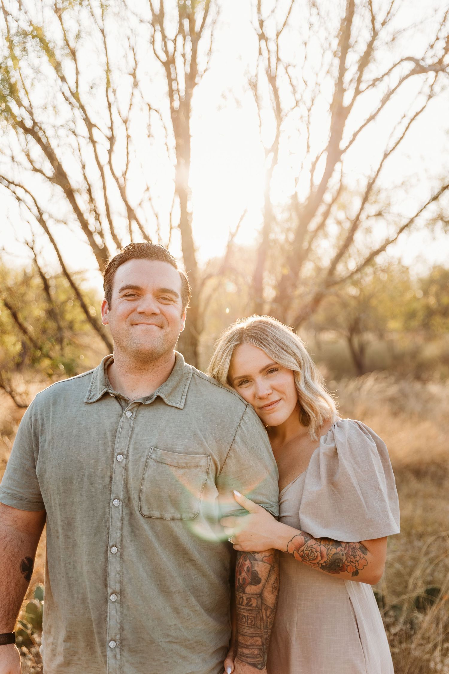 San Antonio couple snuggling at crescent bend nature park.
